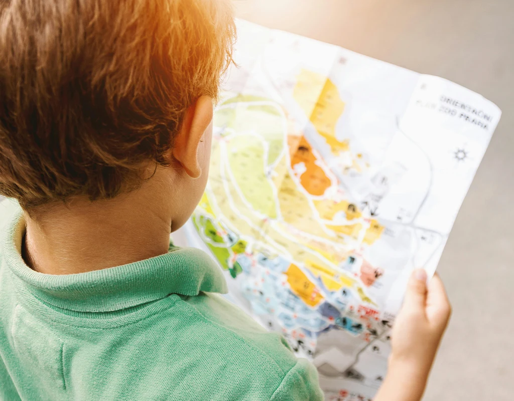 Kid Looking at a map