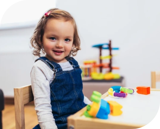 Child at home doing occupational therapy exercises for fine motor skills.