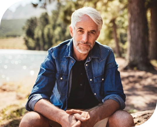 Man in outdoor setting, feeling supported from NDIS Counselling