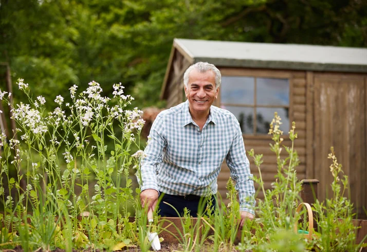 Older man gardening, illustrating how occupational therapy encourages engagement in outdoor activities for better physical and mental well-being.