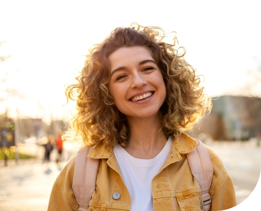 Woman with psychosocial disability outside looking hopeful