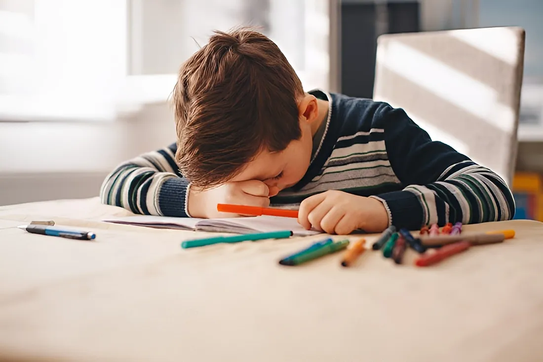 Child with learning difficulties, highlighting the need for occupational therapy to improve fine motor skills.