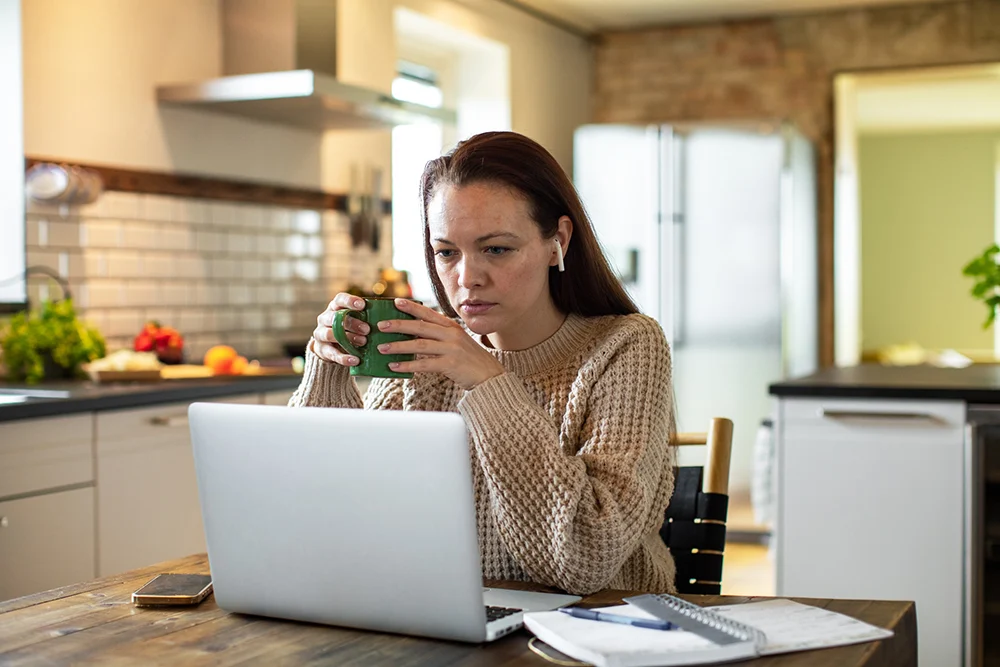 Woman focused in preparing for her teletherapy occupational treament